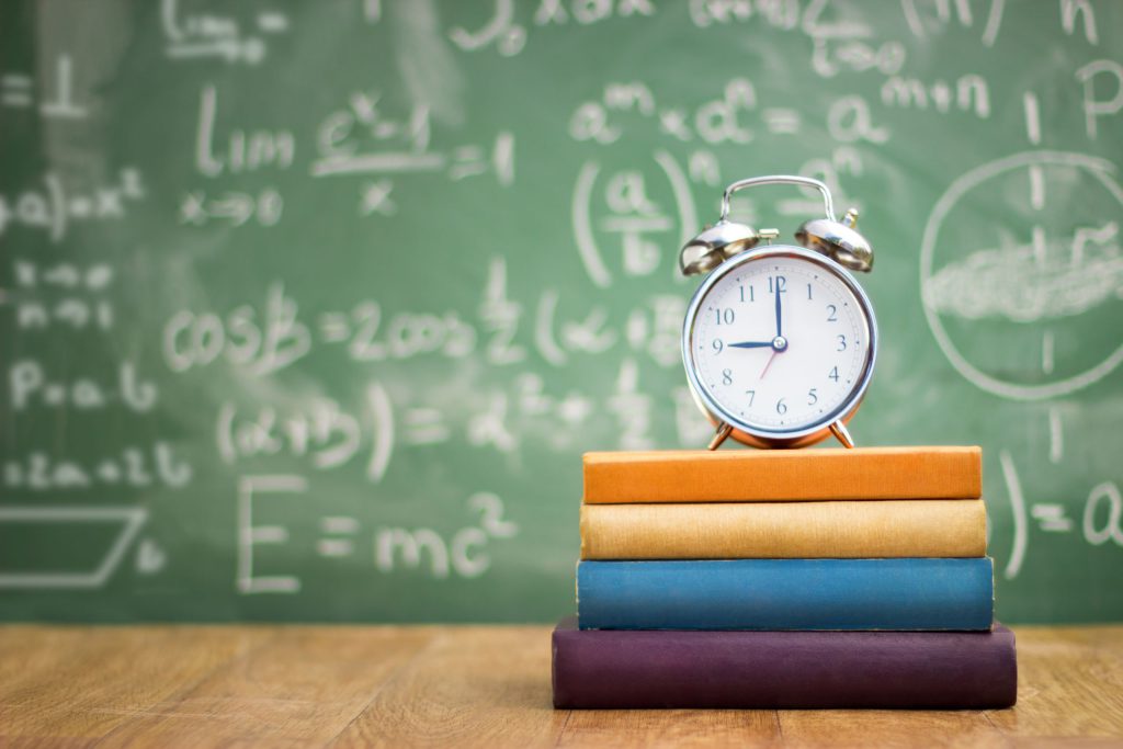 Clock on a stack of books